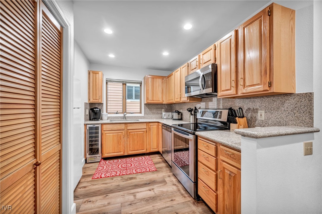 931 Incline Way, Unit 231 Incline Village, NV 89451 - Photo 27 of 39 a kitchen with stainless steel appliances granite countertop a stove a sink dishwasher and a refrigerator