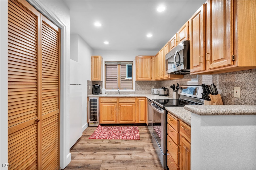 931 Incline Way, Unit 231 Incline Village, NV 89451 - Photo 28 of 39 a kitchen with stainless steel appliances granite countertop a sink and a stove