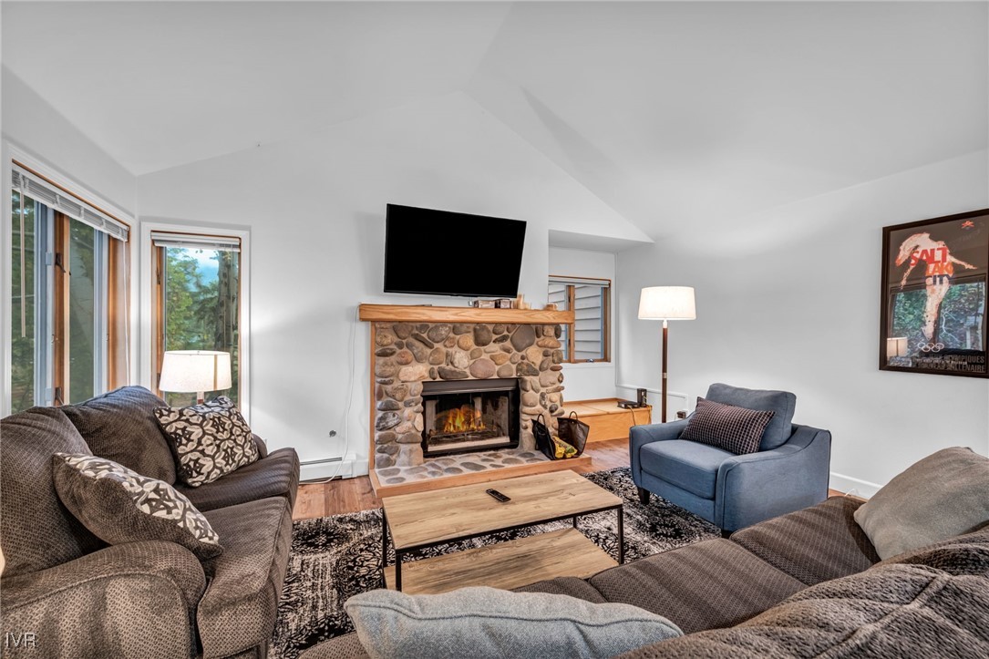 931 Incline Way, Unit 231 Incline Village, NV 89451 - Photo 36 of 39 a living room with furniture a flat screen tv and a fireplace
