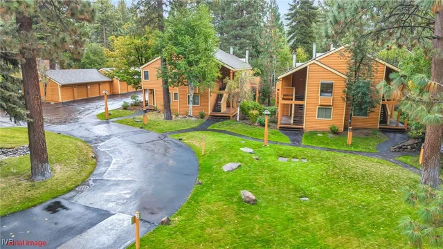 a bathroom with a granite countertop toilet sink and mirror