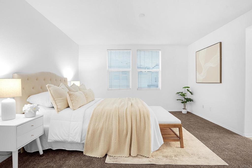 1541 Winter Lane, Unit 4 Chula Vista, CA 91915 - Photo 13 of 23 a bedroom with a bed and a table