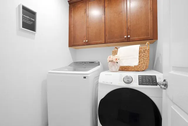 a utility room with dryer and washer