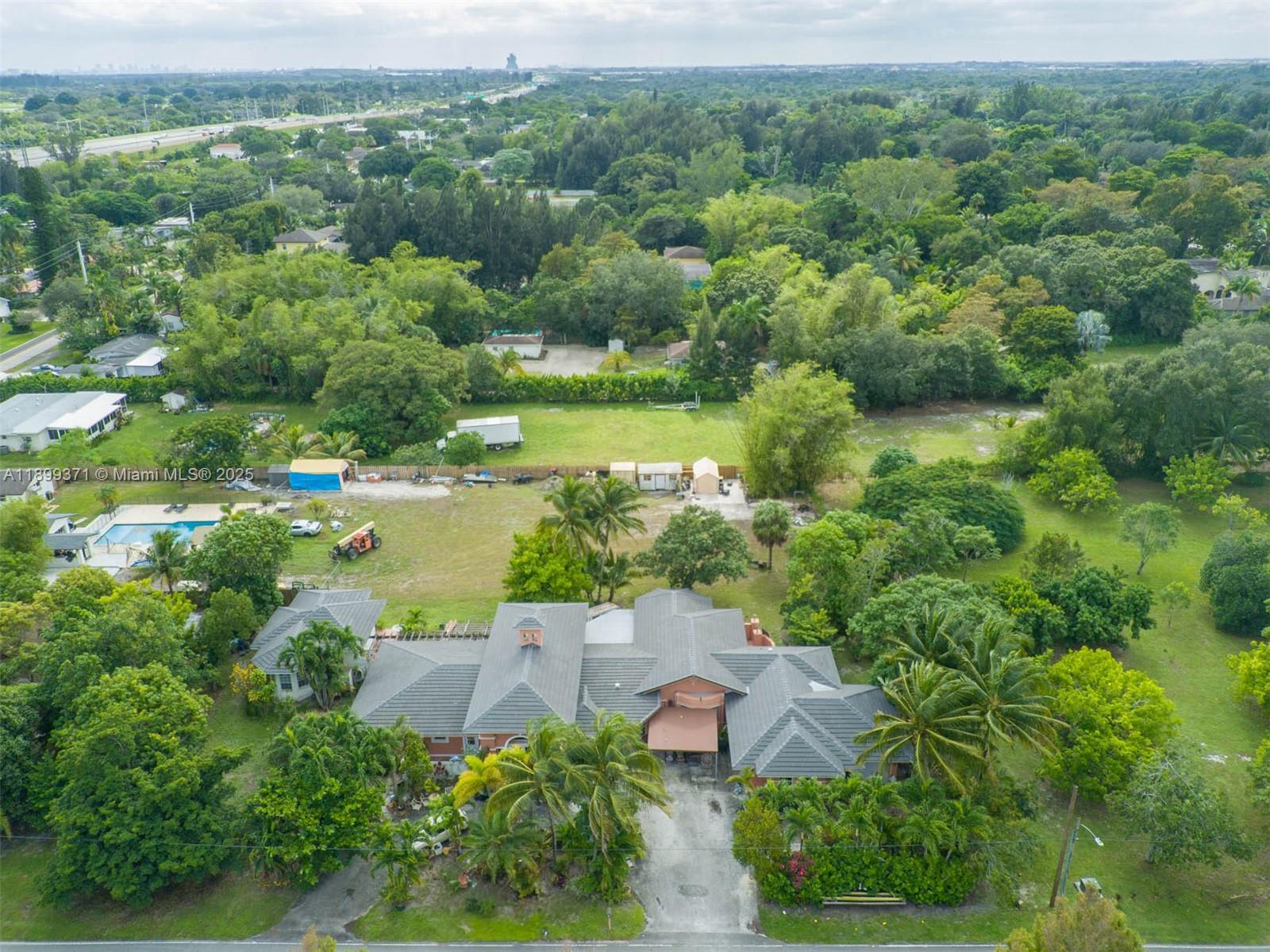 5400 Palm Tree Road Plantation, FL 33317 - Photo 3 of 8 an aerial view of a houses with yard