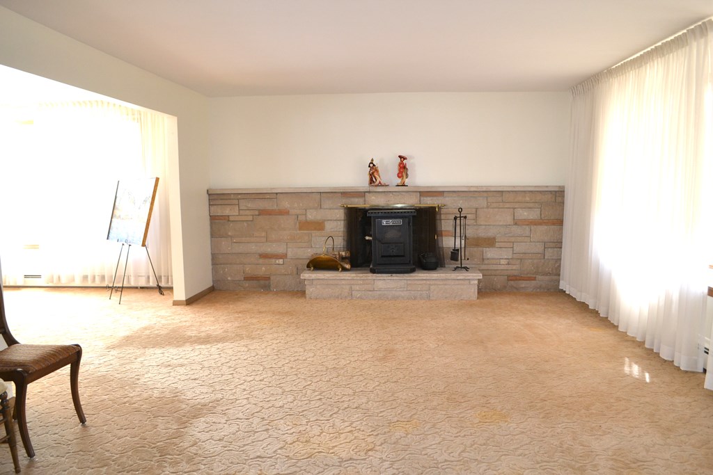 328 Angell Road Lincoln, RI 02865 - Photo 6 of 38 Living room with fireplace which has wood stove insert