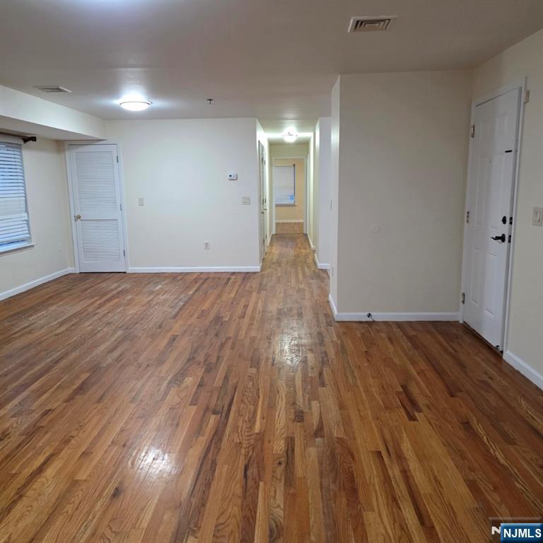 24 Van Vechten Street, Unit 2 Newark, NJ 07114 - Photo 11 of 36 wooden floor in an empty room