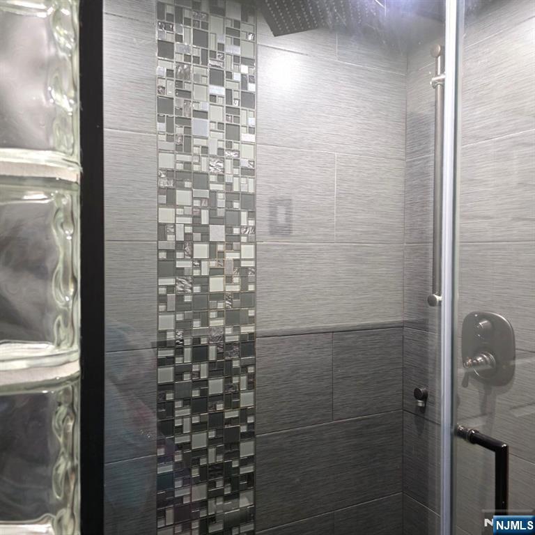 24 Van Vechten Street, Unit 2 Newark, NJ 07114 - Photo 16 of 36 a bathroom with a shower