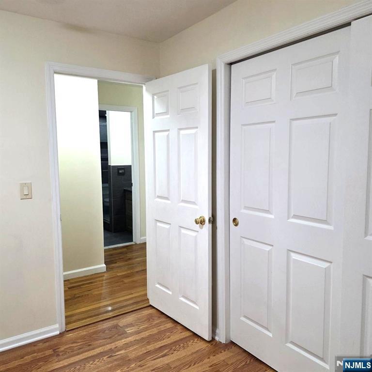 24 Van Vechten Street, Unit 2 Newark, NJ 07114 - Photo 24 of 36 a view of a hallway with wooden floor