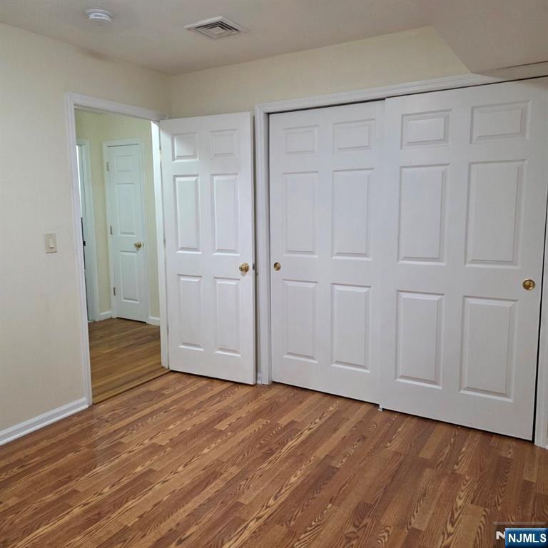 24 Van Vechten Street, Unit 2 Newark, NJ 07114 - Photo 25 of 36 a view of empty room with wooden floor