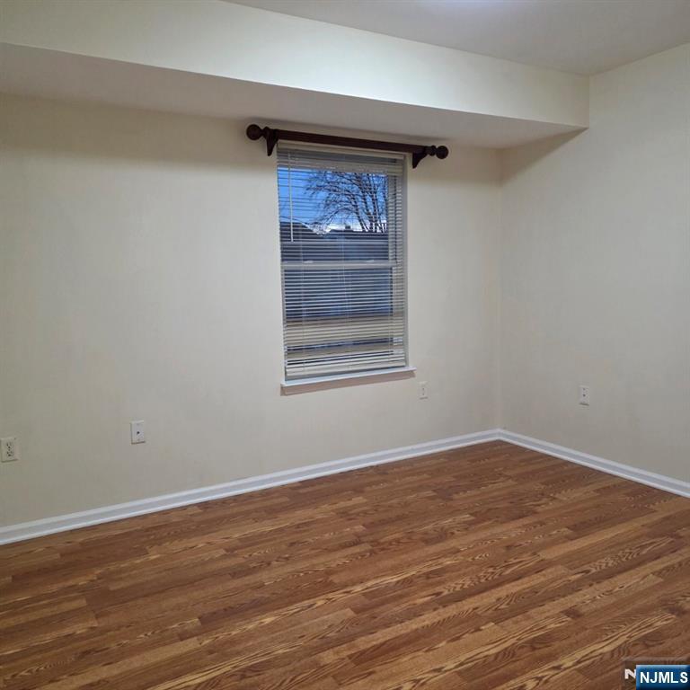 24 Van Vechten Street, Unit 2 Newark, NJ 07114 - Photo 28 of 36 a view of empty room with wooden floor and fan