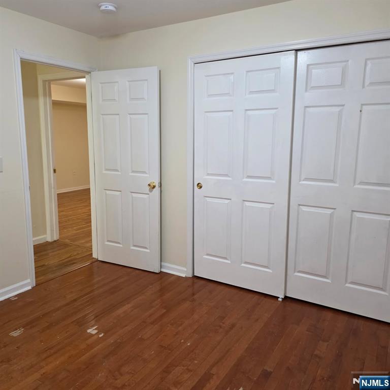24 Van Vechten Street, Unit 2 Newark, NJ 07114 - Photo 29 of 36 a view of an empty room and wooden floor