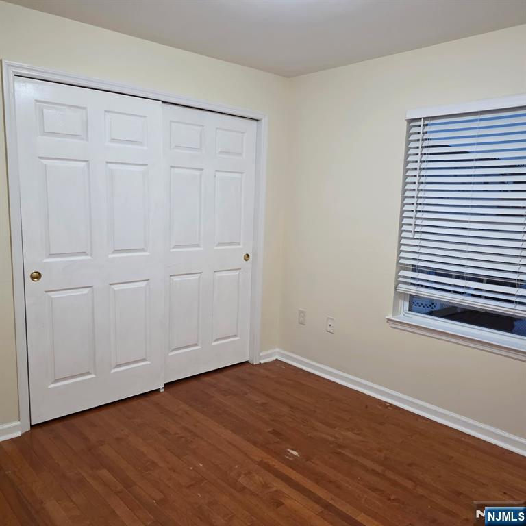 24 Van Vechten Street, Unit 2 Newark, NJ 07114 - Photo 30 of 36 a view of a room with wooden floor and a window