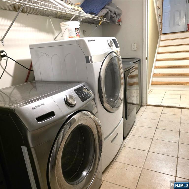 24 Van Vechten Street, Unit 2 Newark, NJ 07114 - Photo 33 of 36 a utility room with dryer and washer