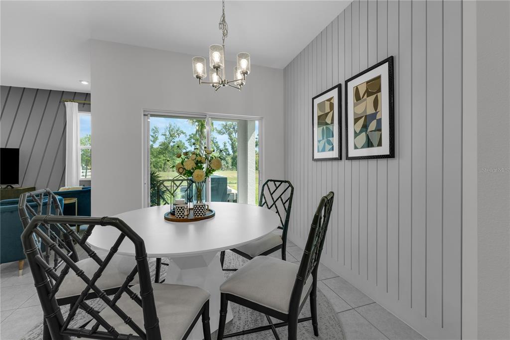 1267 Blue Daze Lane Eustis, FL 32726 - Photo 11 of 34 a view of a dining room with furniture window and wooden floor