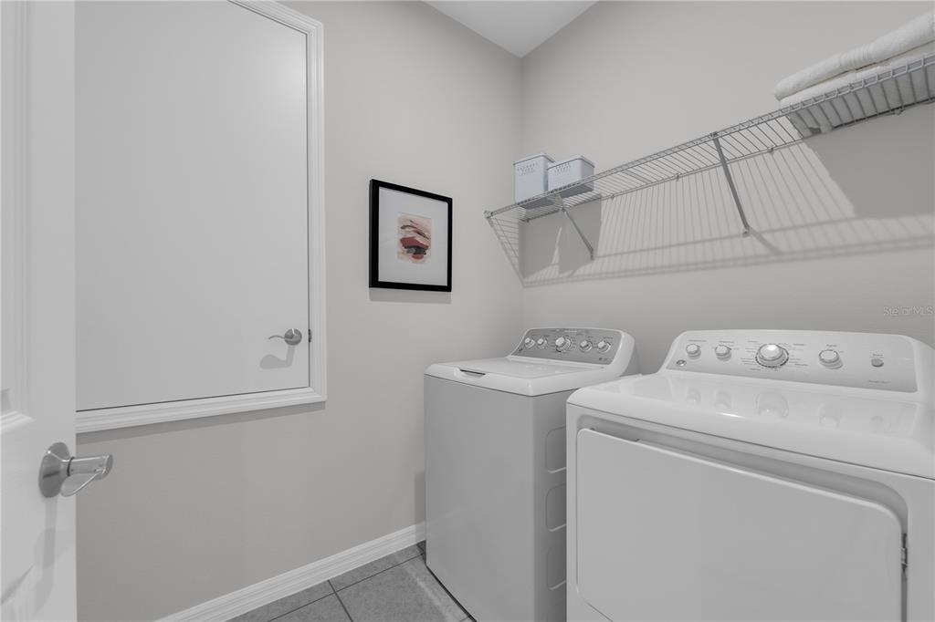 1267 Blue Daze Lane Eustis, FL 32726 - Photo 26 of 34 a utility room with dryer and washer