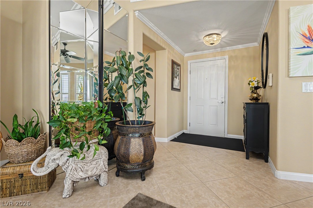 2555 Hampton Road, Unit 3308 Henderson, NV 89052 - Photo 7 of 65 Step into a welcoming entry with decorative mirrors and crown molding.