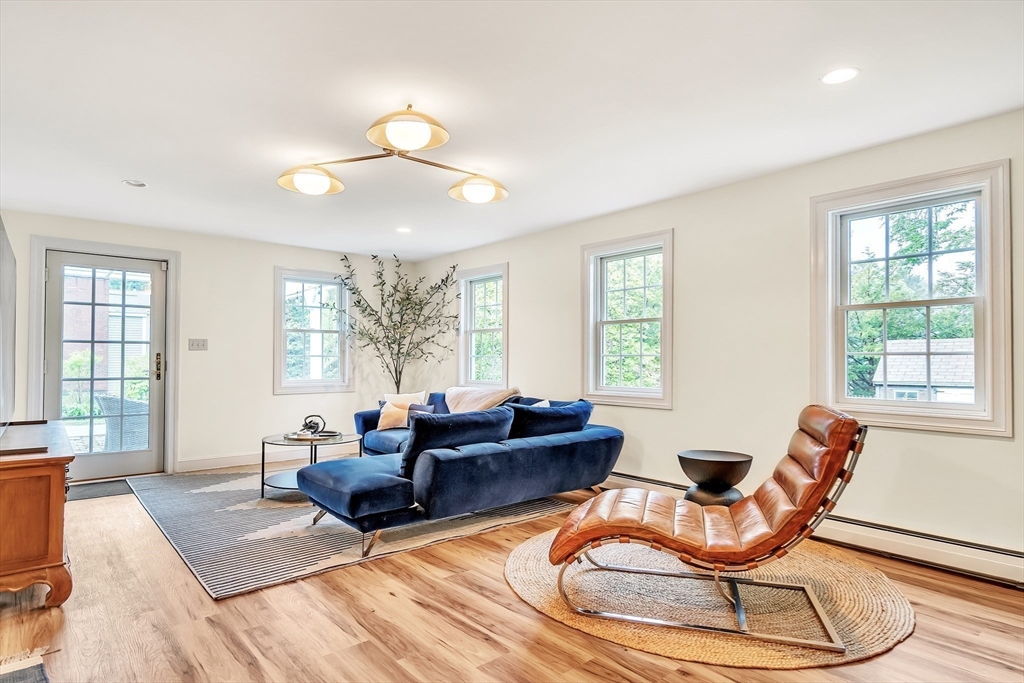 10 Ballard Terrace Lexington, MA 02420 - Photo 27 of 42 a living room with furniture and floor to ceiling windows