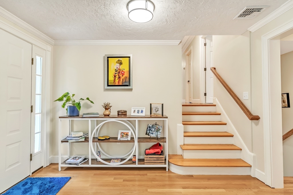10 Ballard Terrace Lexington, MA 02420 - Photo 3 of 42 a view of entryway with wooden floor