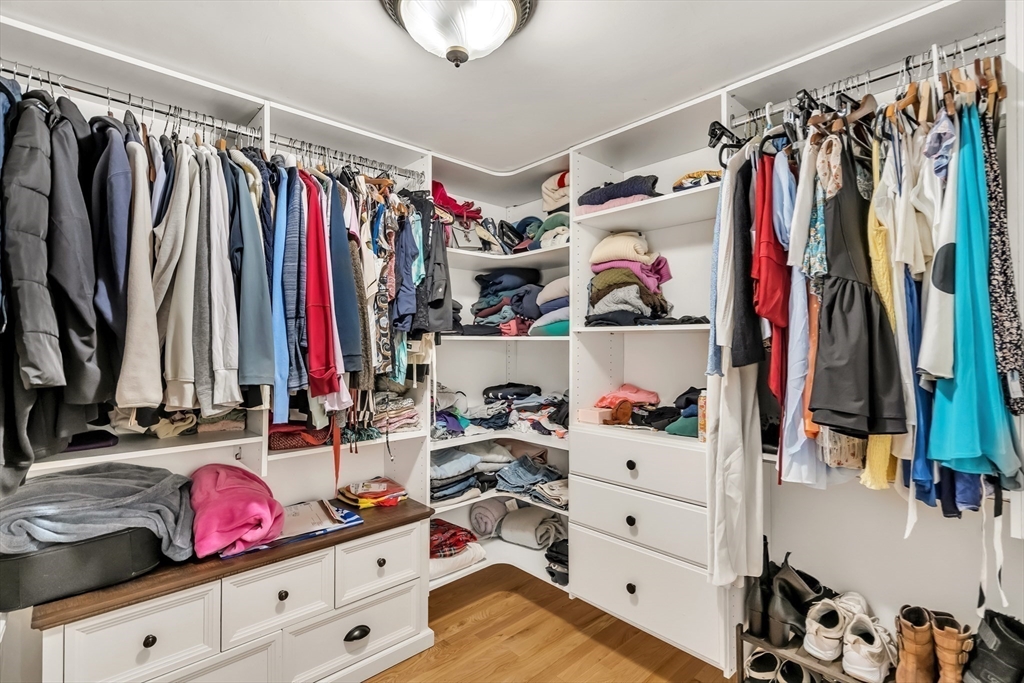 10 Ballard Terrace Lexington, MA 02420 - Photo 32 of 42 a view of walk in closet with clothes and shoes