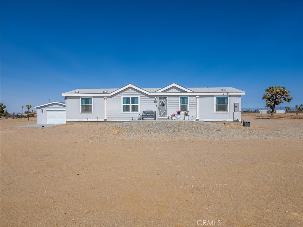 14275 Lager Road Phelan, CA 92371 - Photo 1 of 1 a front view of a house with a yard