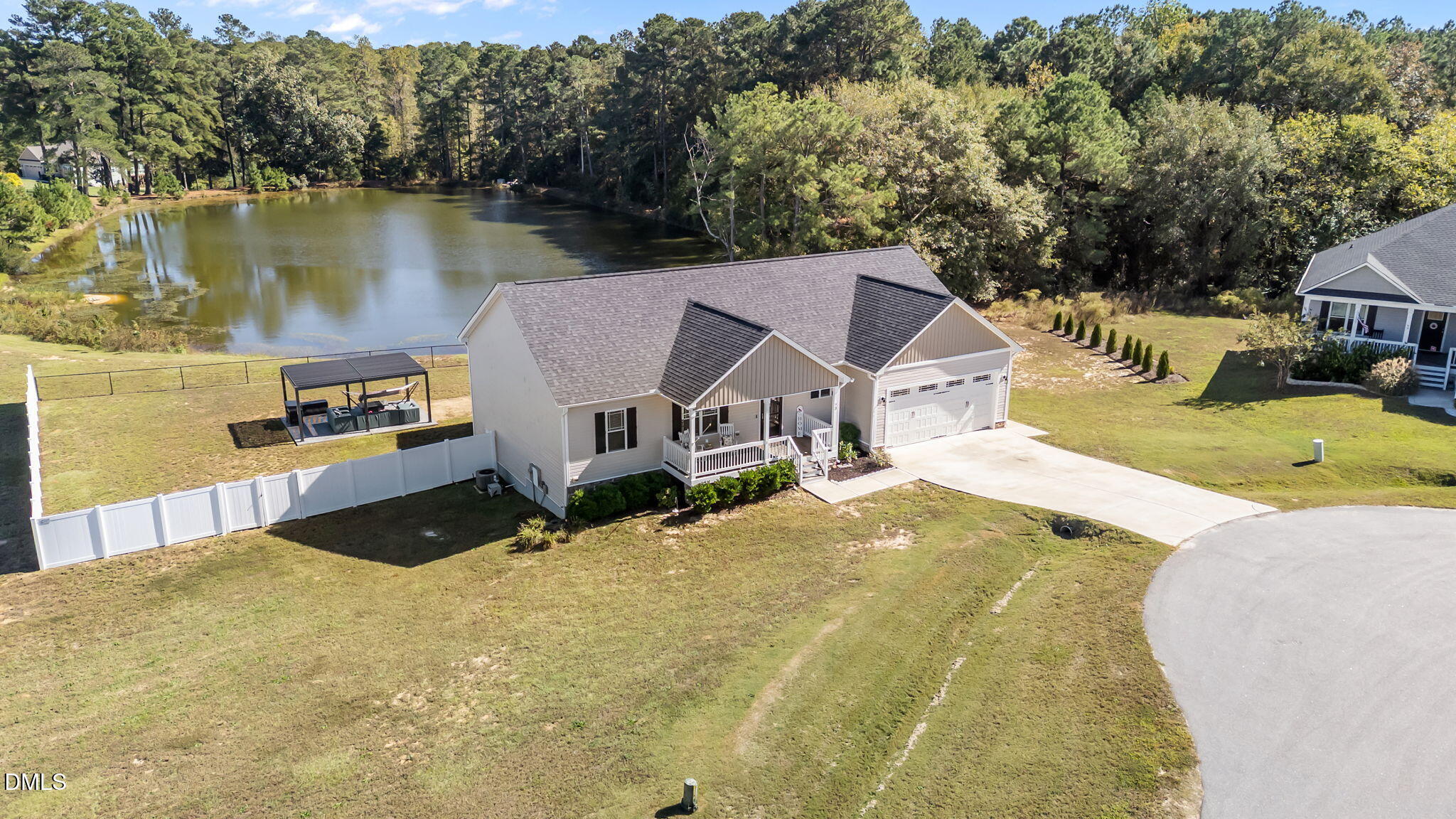 a view of a house with pool and lake view