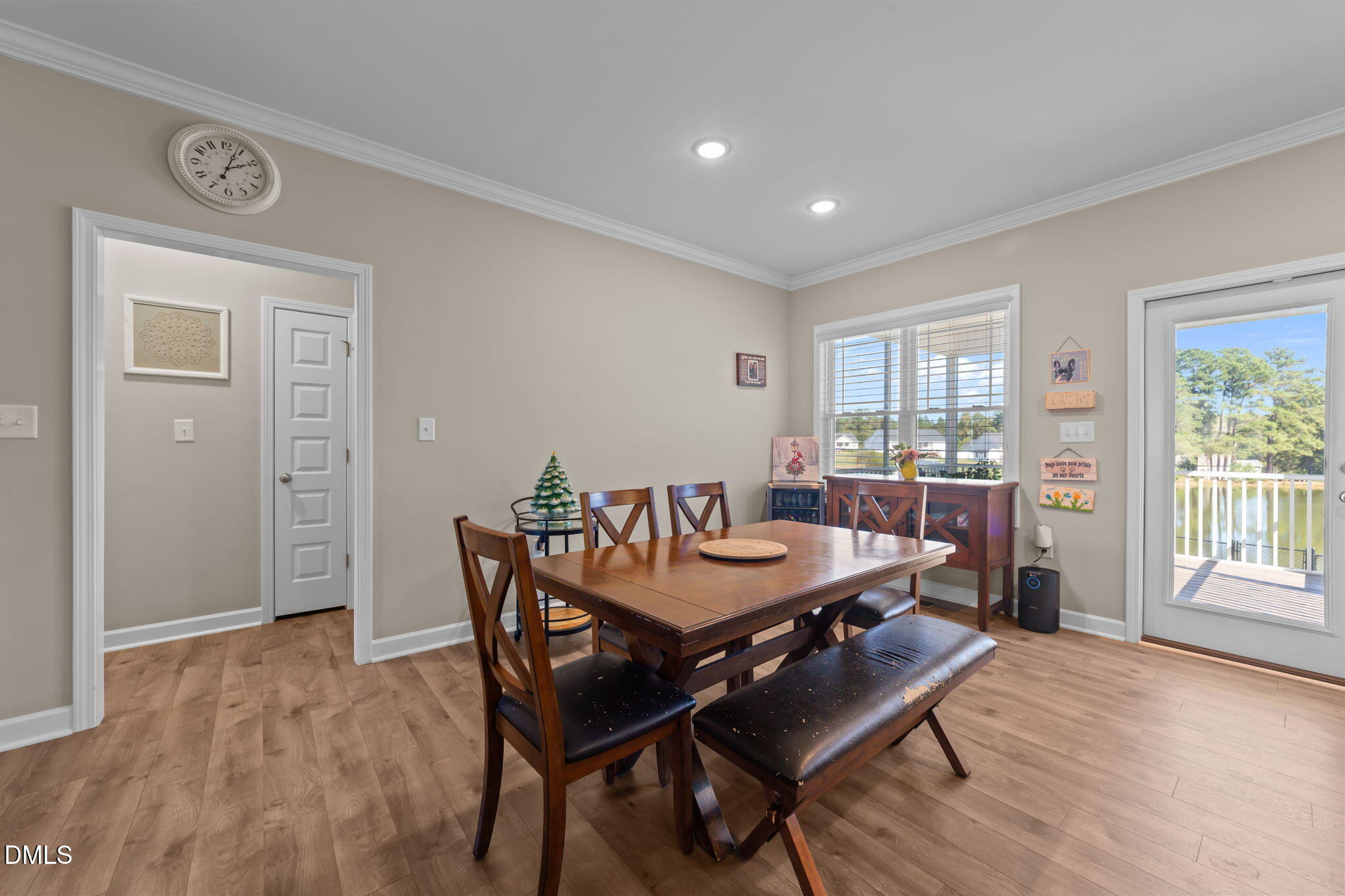 73 Rabbit Run Drive Smithfield, NC 27577 - Photo 14 of 46 a view of a dining room with furniture and wooden floor