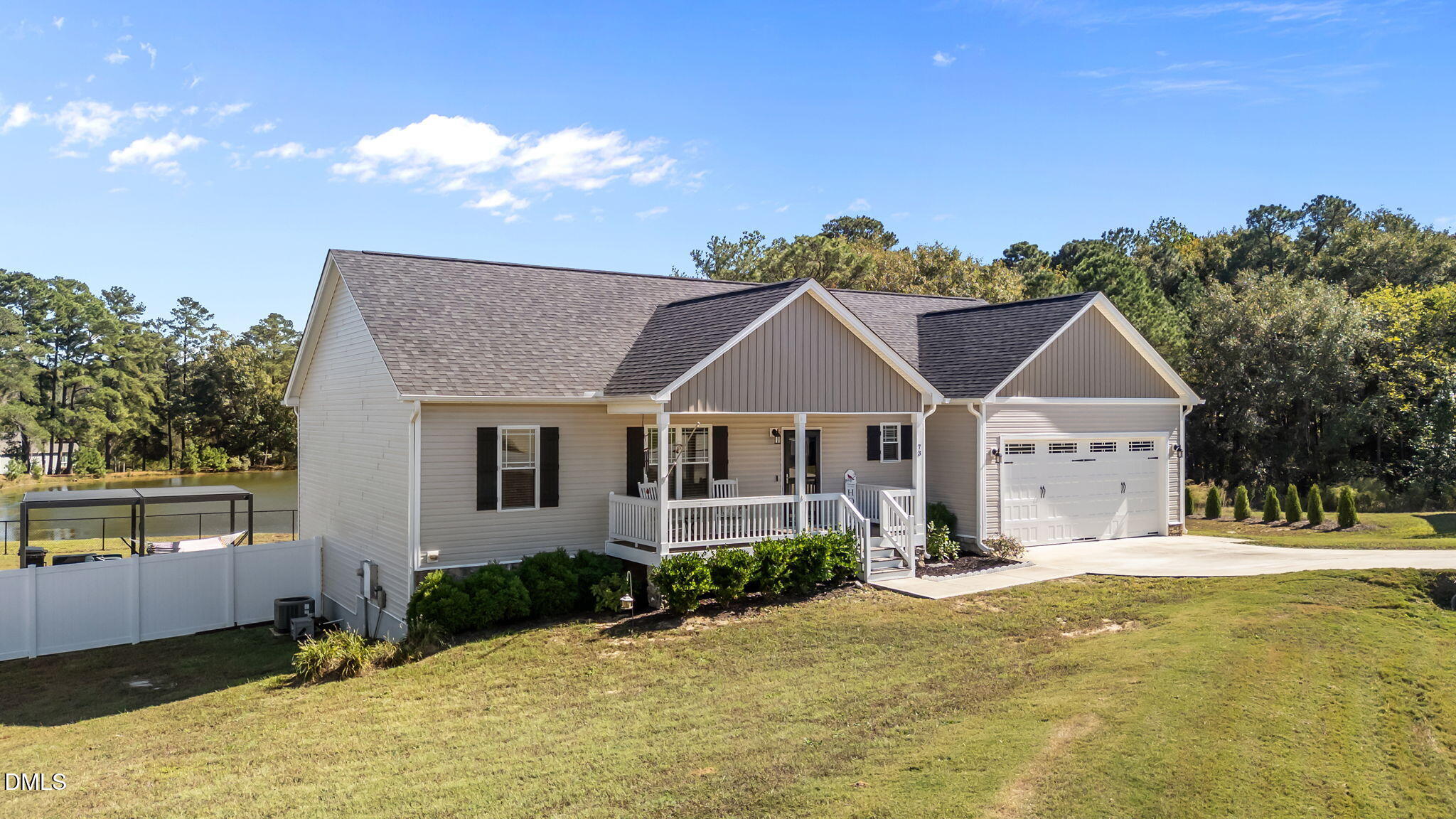 73 Rabbit Run Drive Smithfield, NC 27577 - Photo 2 of 46 a front view of a house with a yard