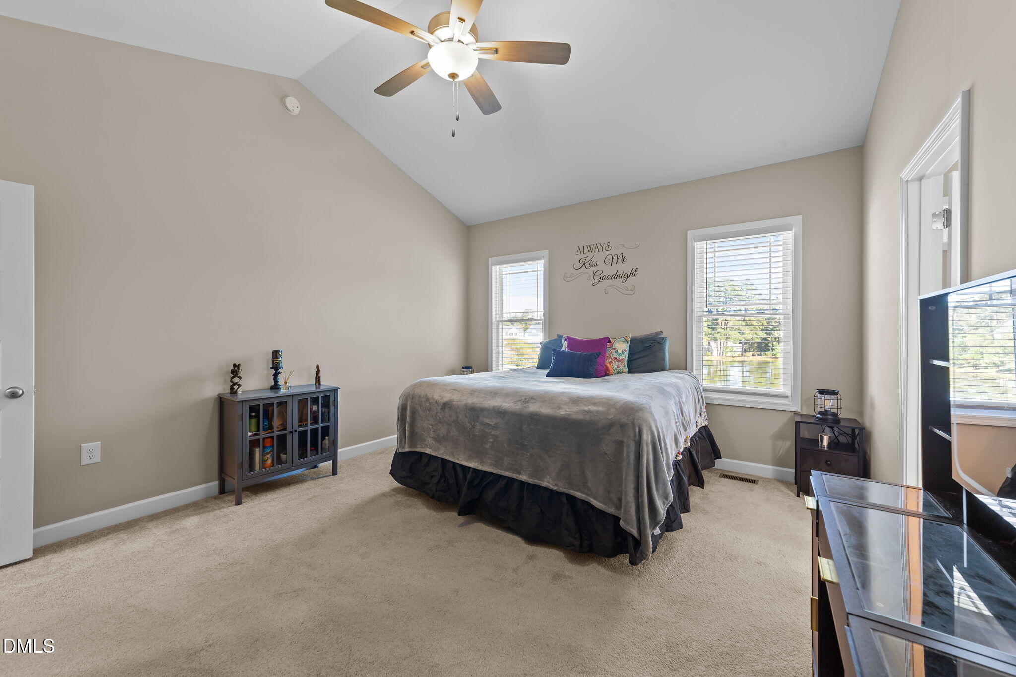 73 Rabbit Run Drive Smithfield, NC 27577 - Photo 22 of 46 a bedroom with a bed table and a flat tv screen
