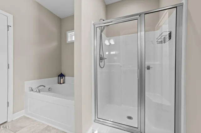 a white bath tub sitting next to a window