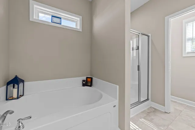 a bedroom with a bed and a desk