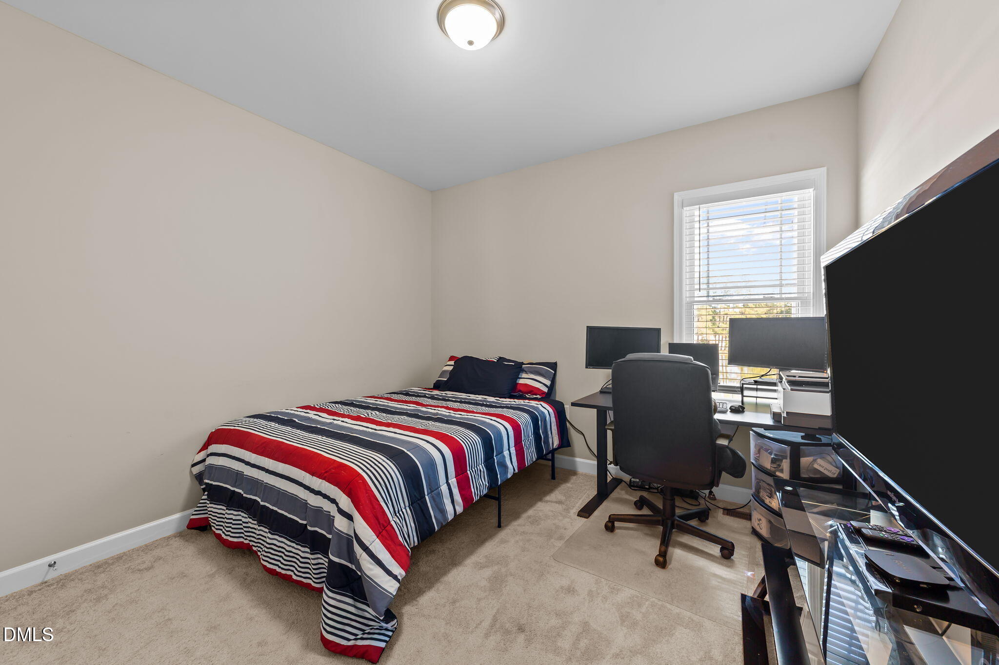 73 Rabbit Run Drive Smithfield, NC 27577 - Photo 26 of 46 a bedroom with a bed and a desk