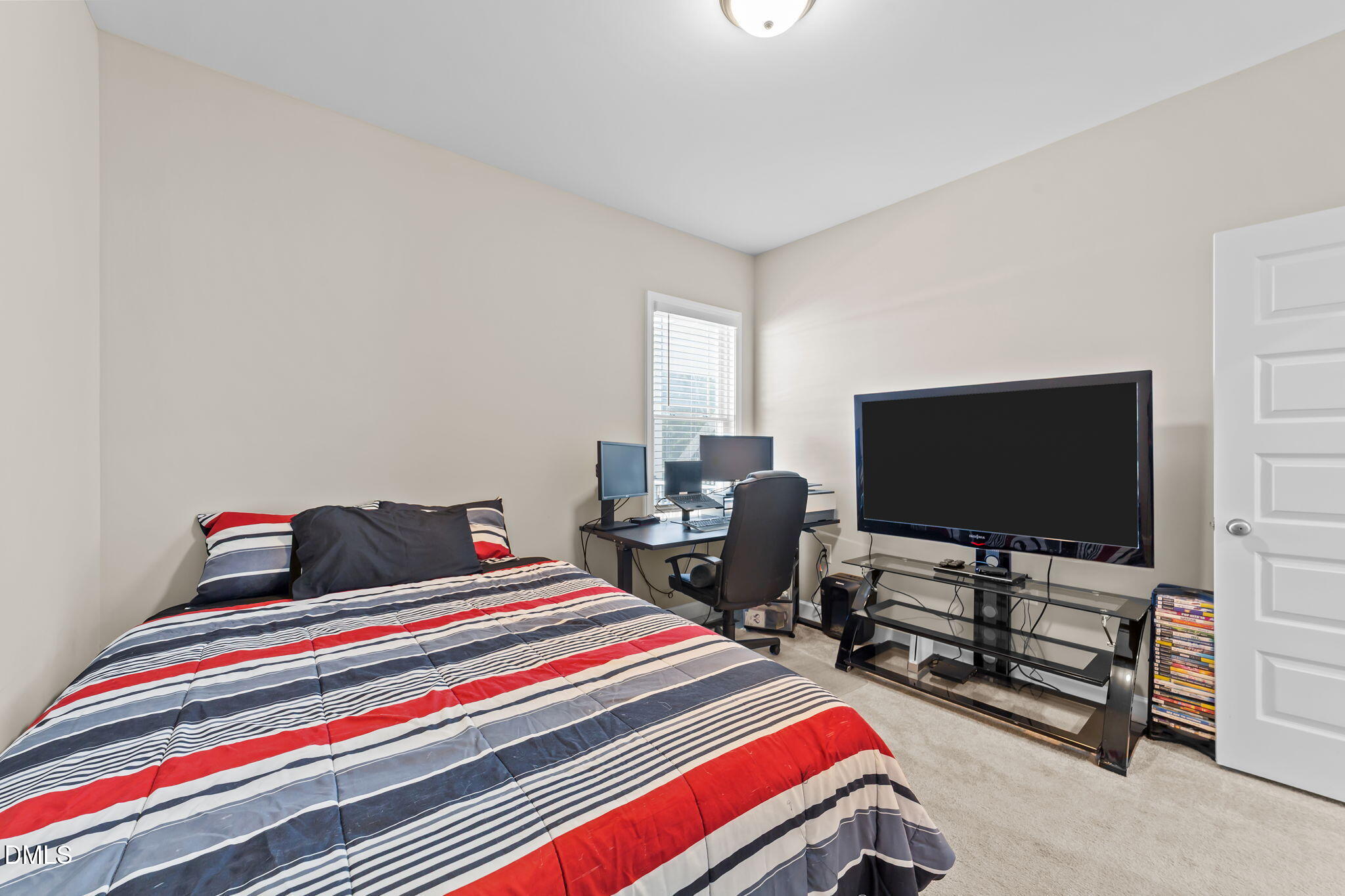 73 Rabbit Run Drive Smithfield, NC 27577 - Photo 27 of 46 a bedroom with bed and tv on desk