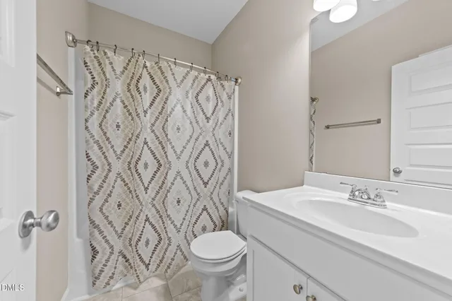 a bedroom with a bed and cabinets