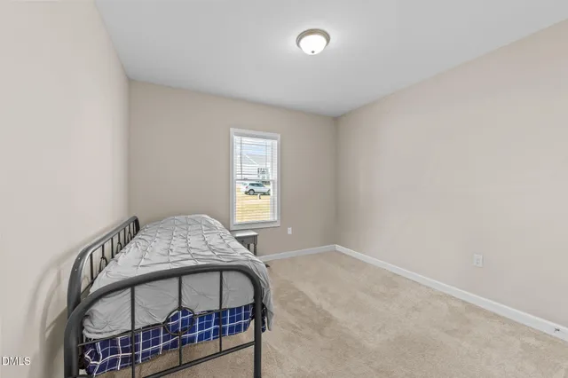 a view of a house with wooden deck