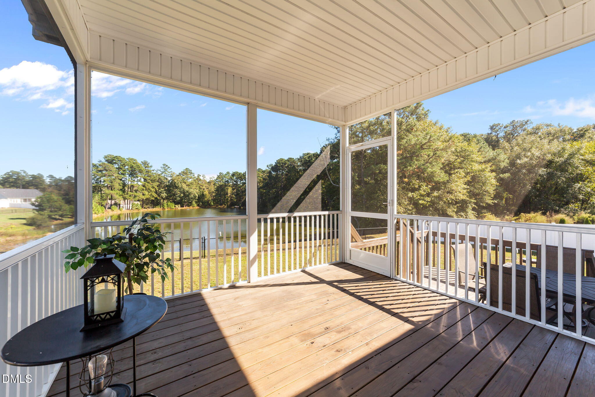73 Rabbit Run Drive Smithfield, NC 27577 - Photo 32 of 46 a view of a balcony with lake view and wooden floor