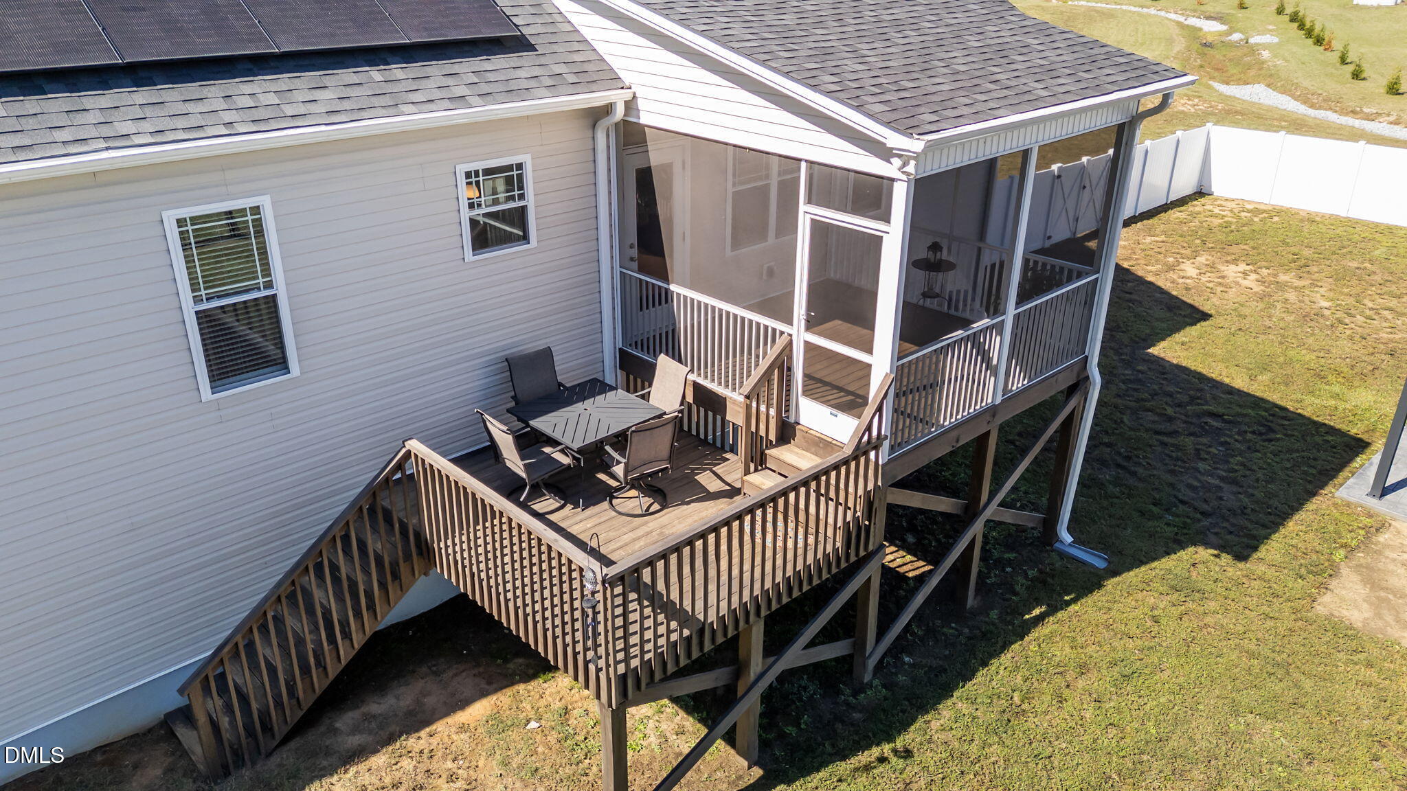 73 Rabbit Run Drive Smithfield, NC 27577 - Photo 34 of 46 a balcony of a house with wooden floor and outdoor seating
