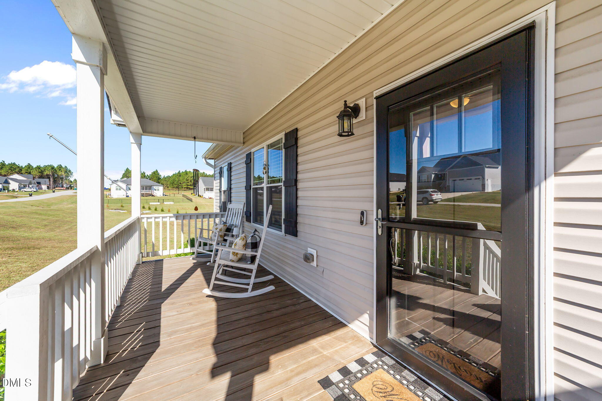 73 Rabbit Run Drive Smithfield, NC 27577 - Photo 8 of 46 a view of a balcony with chairs and wooden floor