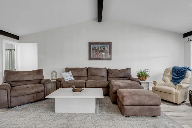 a living room with furniture and a couch