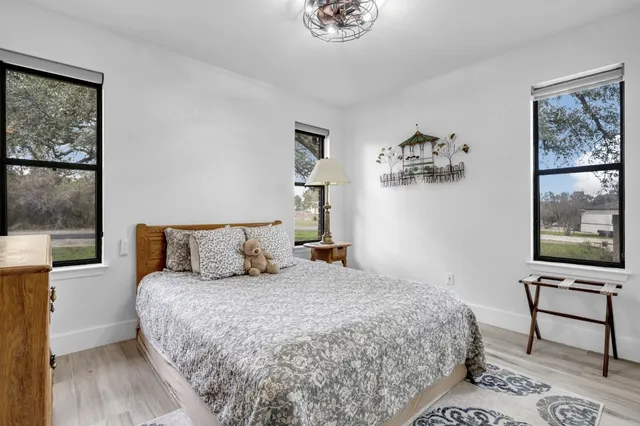 a bedroom with a large bed and a window