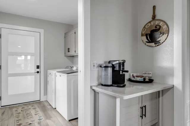 a kitchen with a refrigerator and cabinets