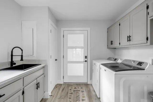 a view of a kitchen with sink and dishwasher