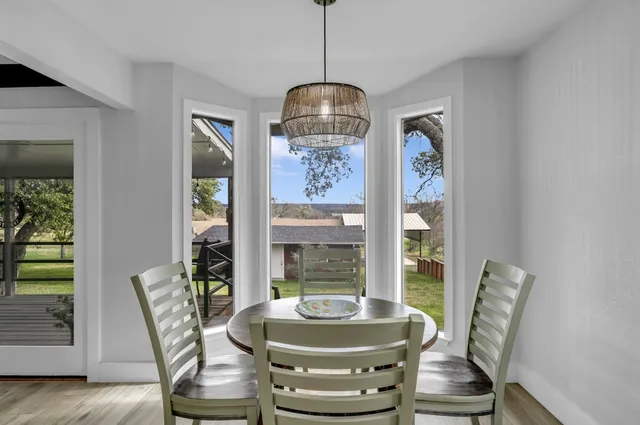 a dining room with furniture and window