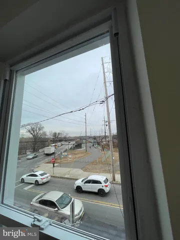 a view of a balcony with car parked