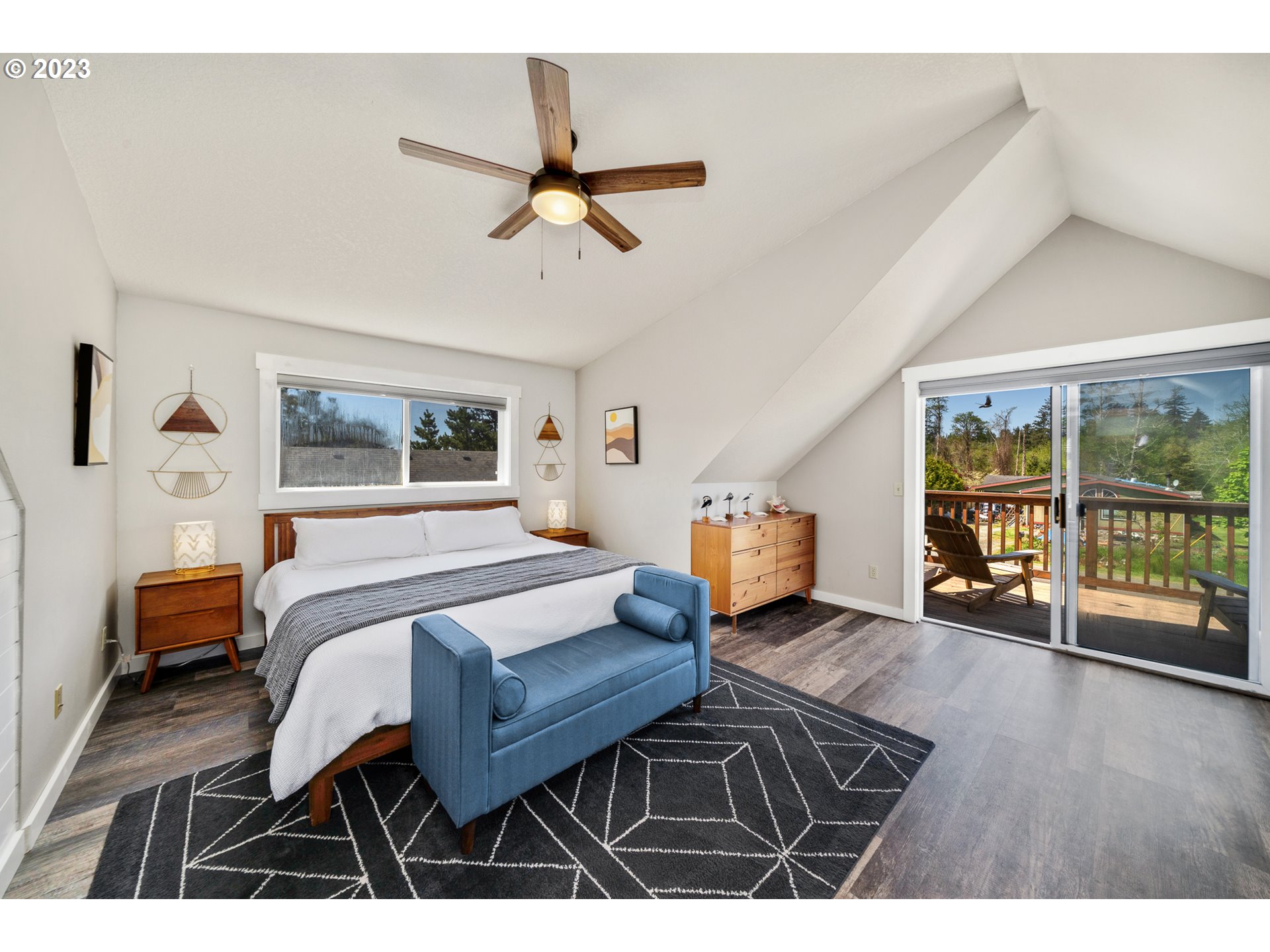 34010 Mallard Avenue Nehalem, OR 97131 - Photo 11 of 25 a bedroom with furniture and a window