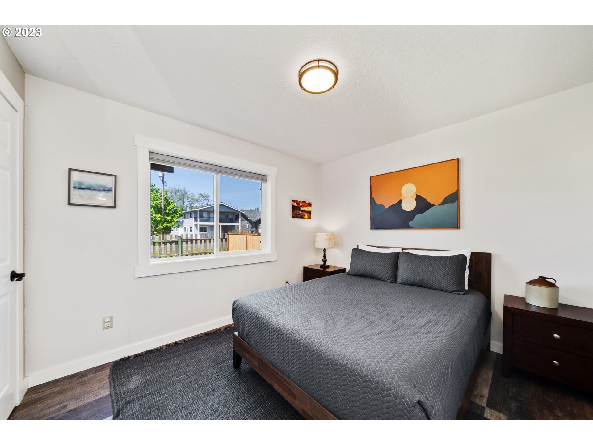 34010 Mallard Avenue Nehalem, OR 97131 - Photo 19 of 25 a bedroom with a bed and a flat screen tv