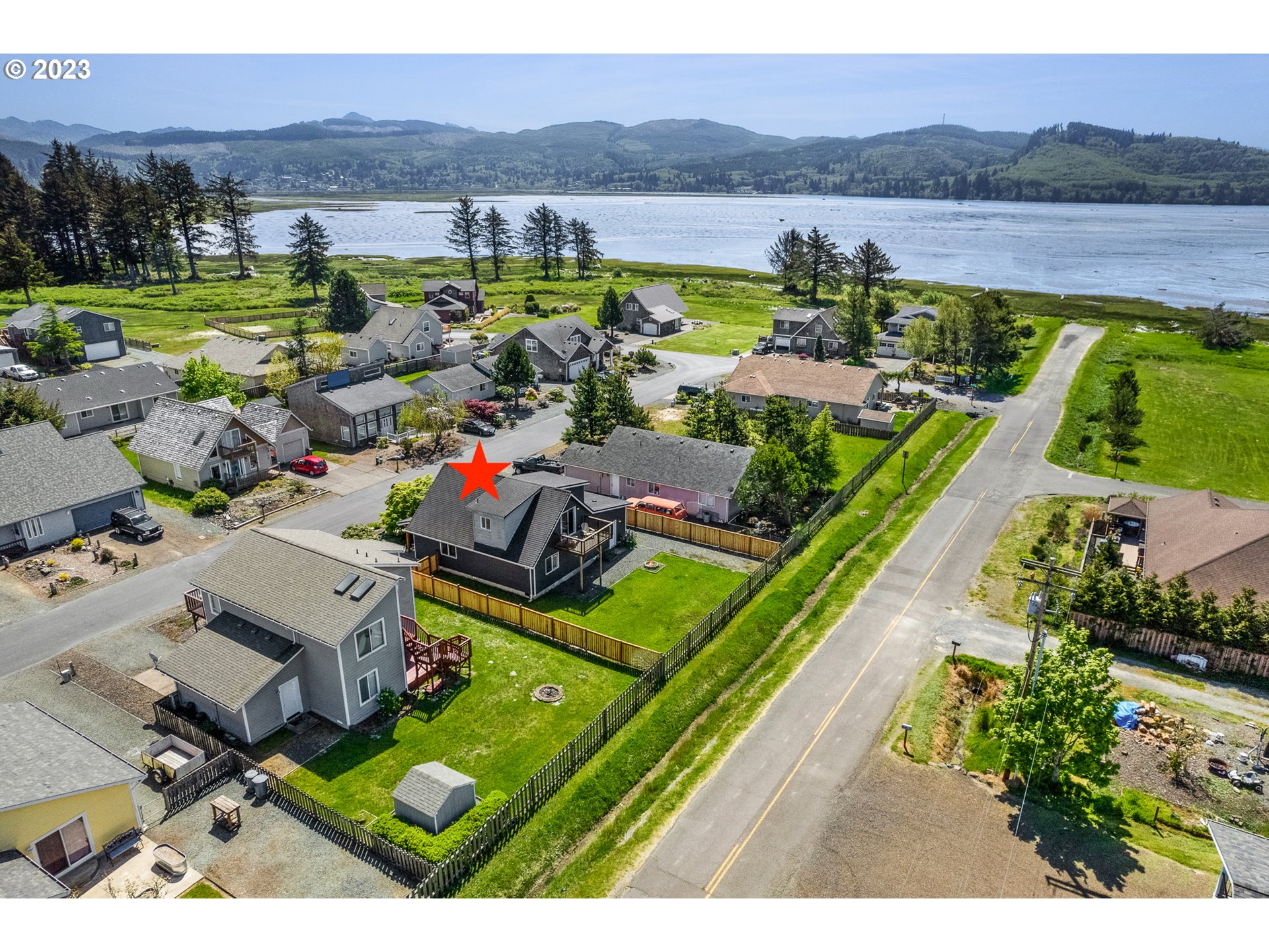 34010 Mallard Avenue Nehalem, OR 97131 - Photo 2 of 25 an aerial view of a house with a garden