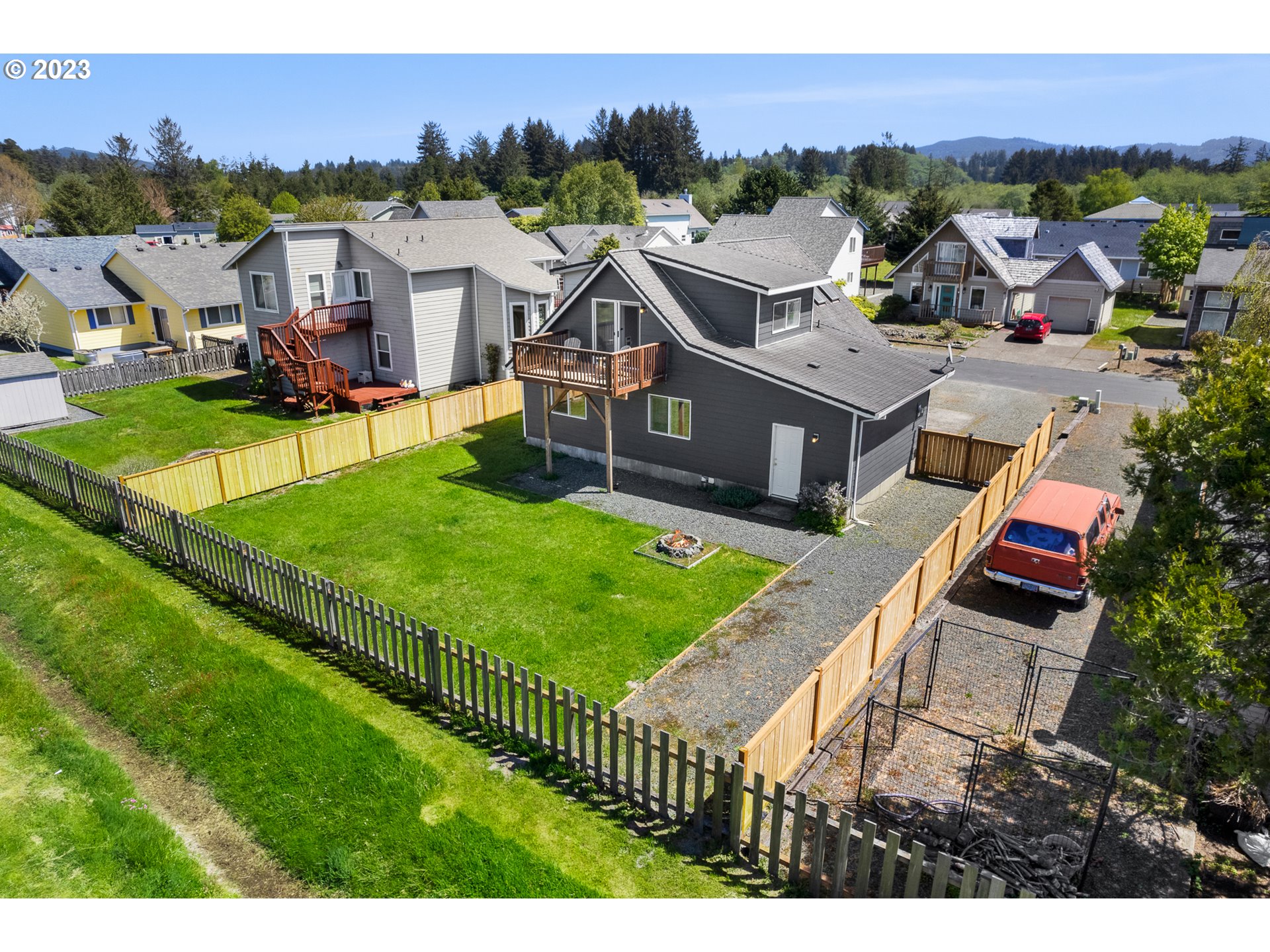 34010 Mallard Avenue Nehalem, OR 97131 - Photo 22 of 25 a aerial view of a house with a big yard