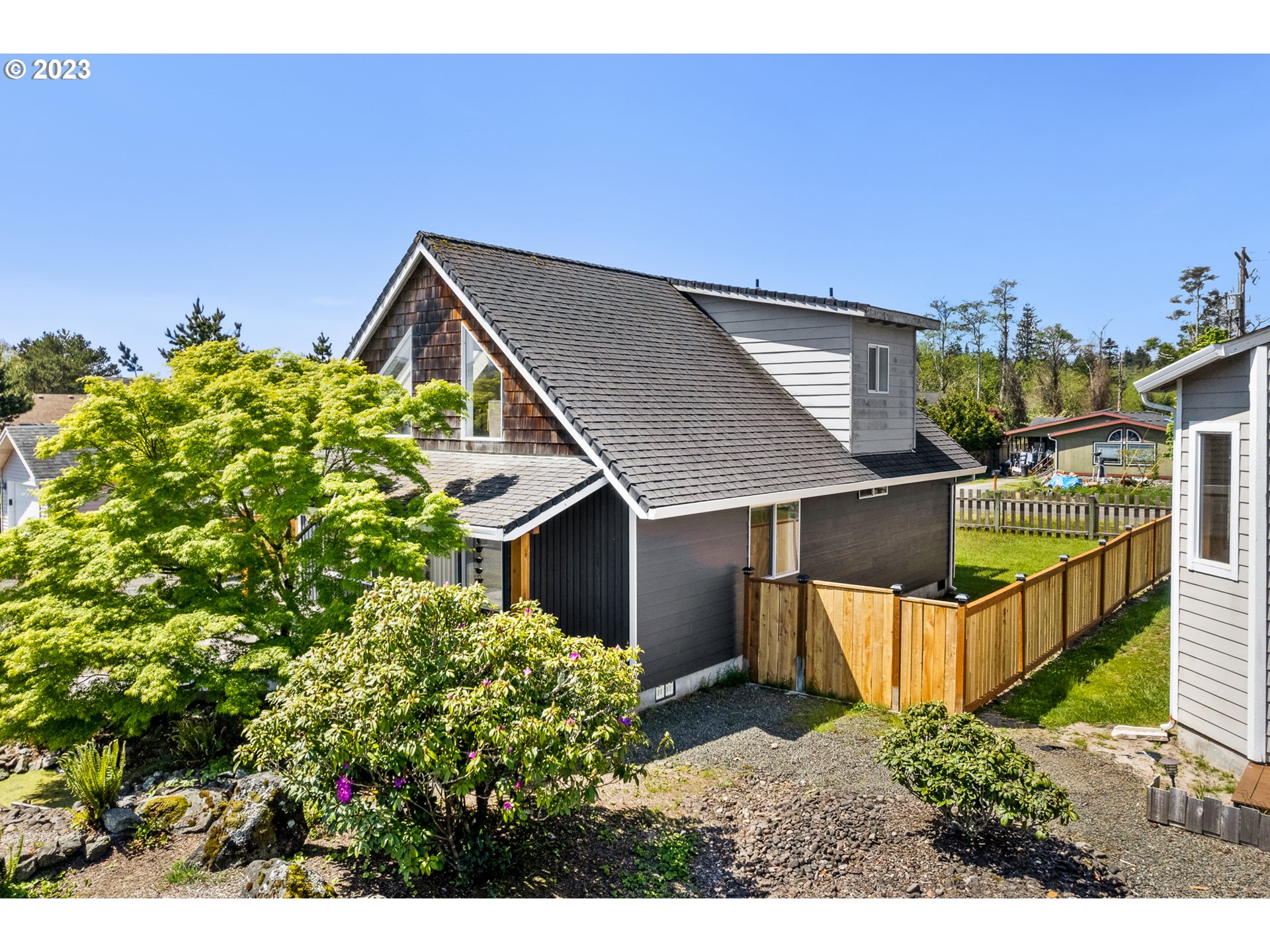 34010 Mallard Avenue Nehalem, OR 97131 - Photo 25 of 25 a backyard of a house with lots of green space