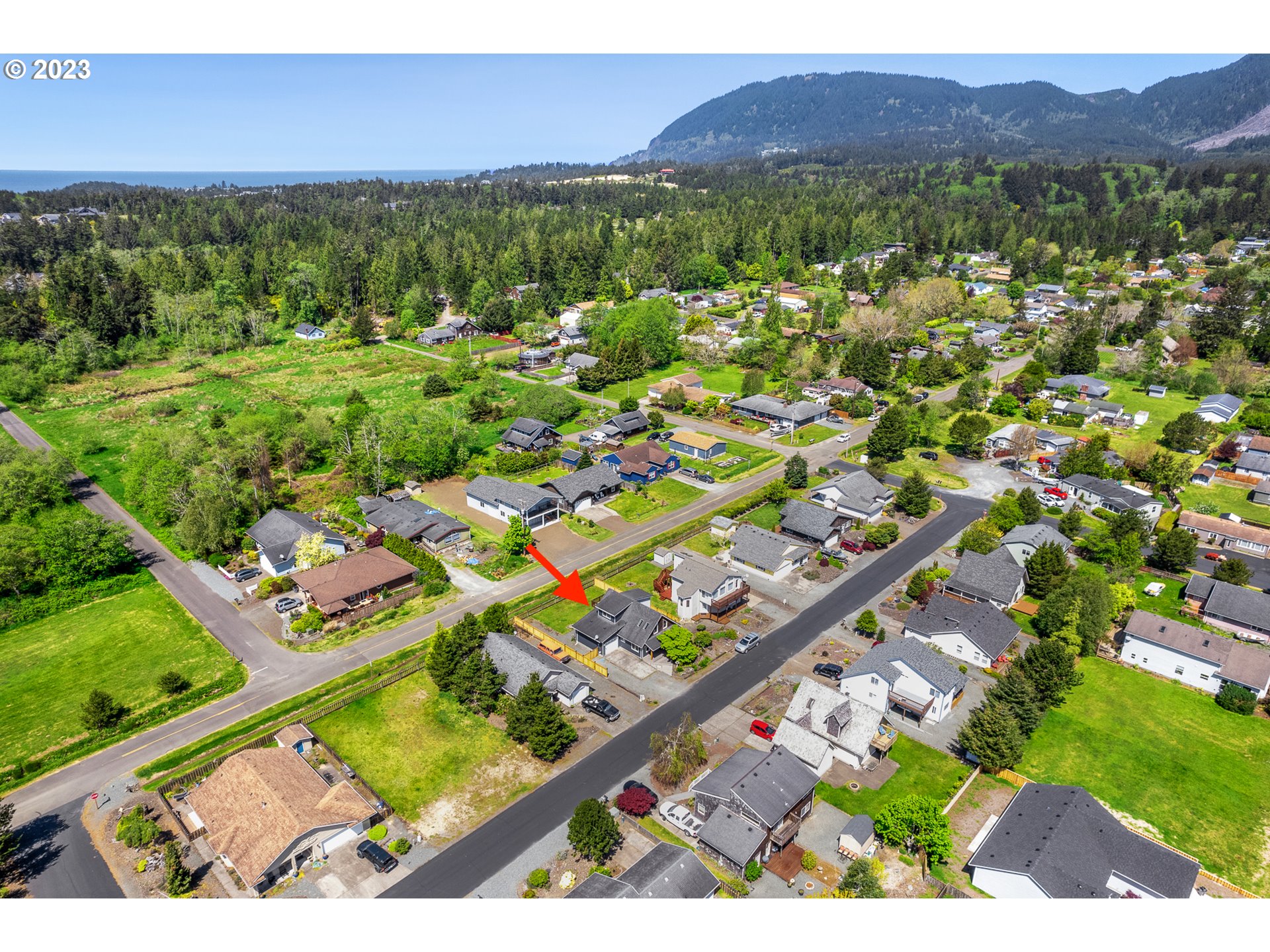 34010 Mallard Avenue Nehalem, OR 97131 - Photo 3 of 25 a view of a city with a mountain