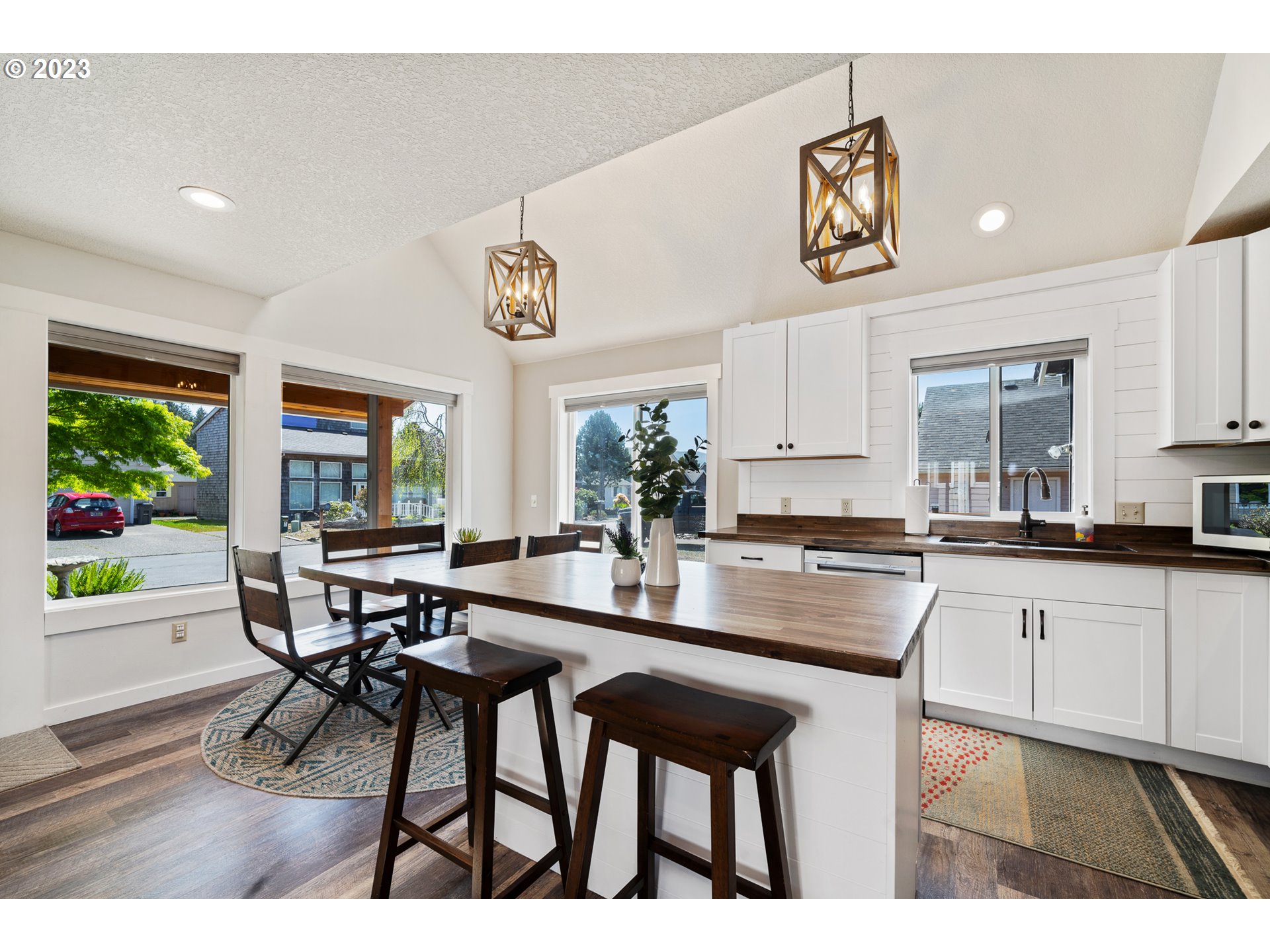 34010 Mallard Avenue Nehalem, OR 97131 - Photo 6 of 25 a kitchen with a table and chairs in it