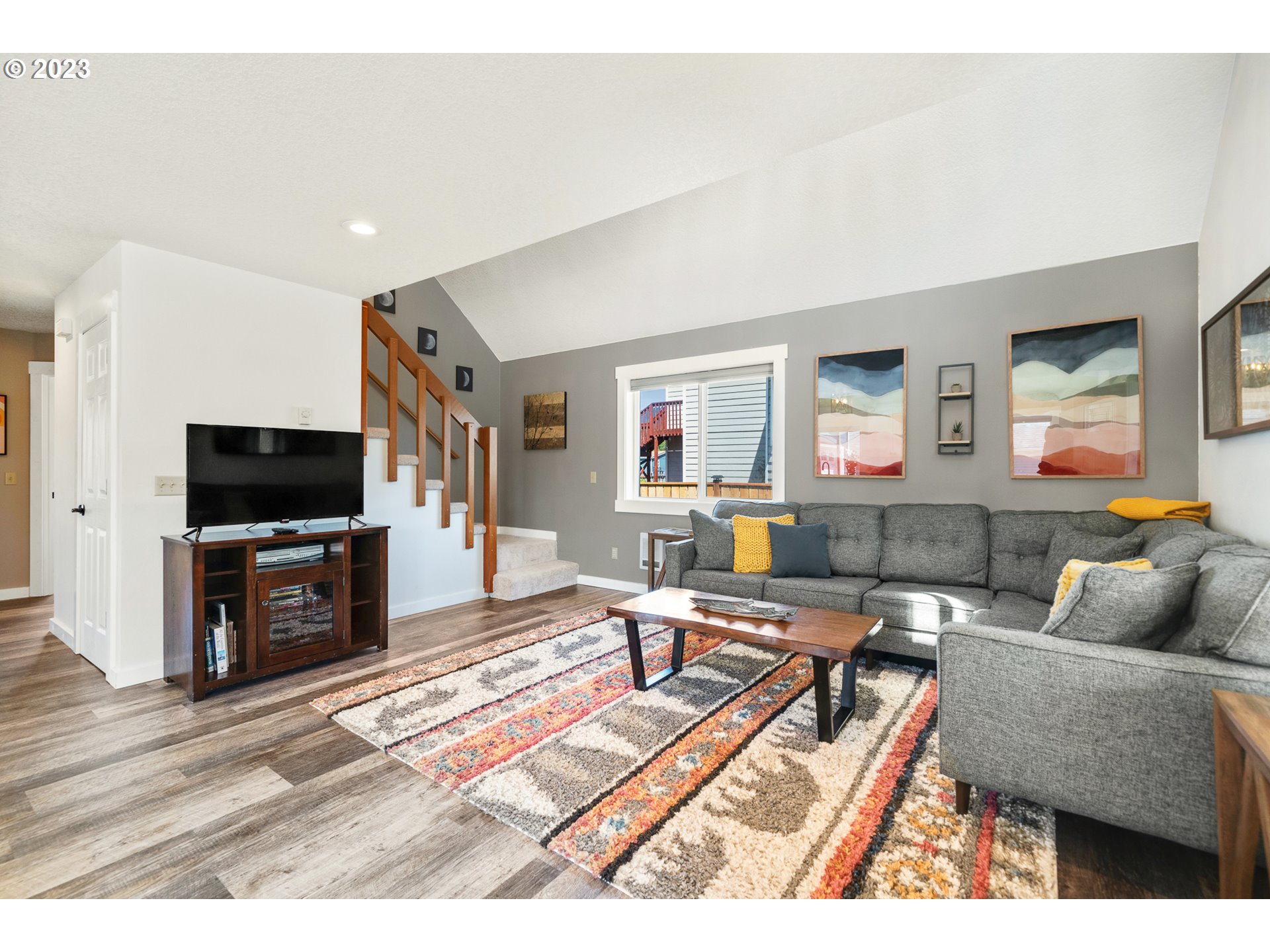 34010 Mallard Avenue Nehalem, OR 97131 - Photo 10 of 25 a living room with furniture and a flat screen tv